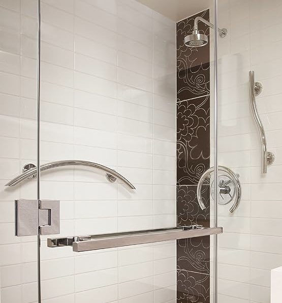 A beautiful bathroom with shower head and transparent doors